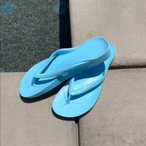Archie’s Blue Flip Flops
